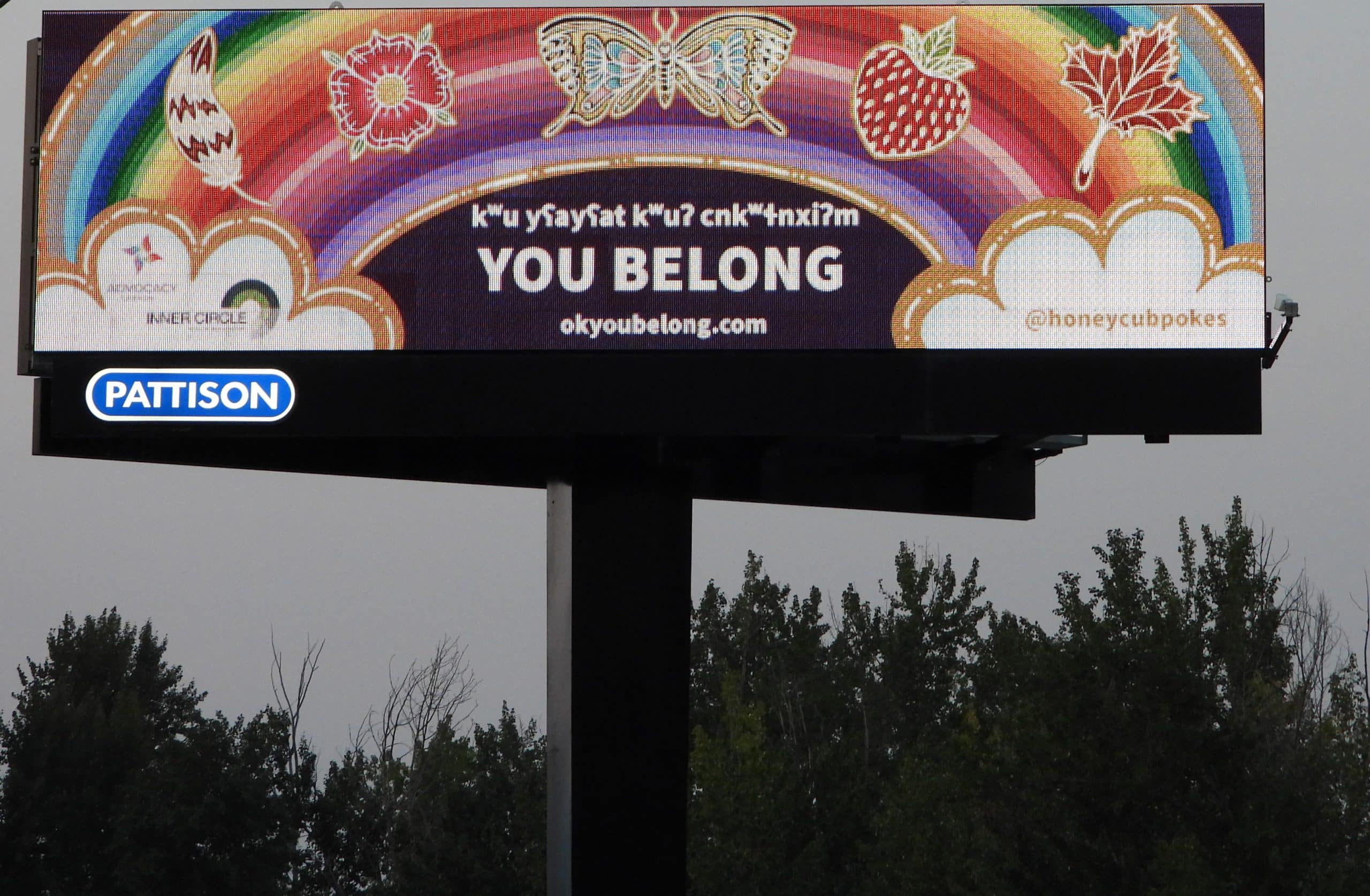 Billboard with rainbow banner and You Belong message