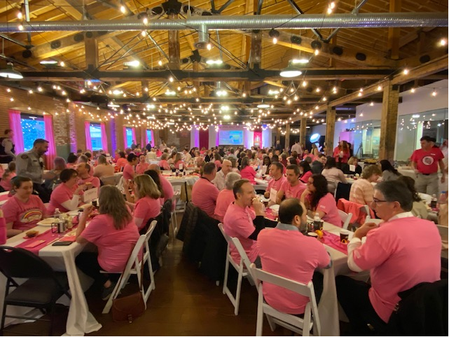 Pink Shirt Day Breakfast - people sitting at tables in a large hall, all wearing pink shirts