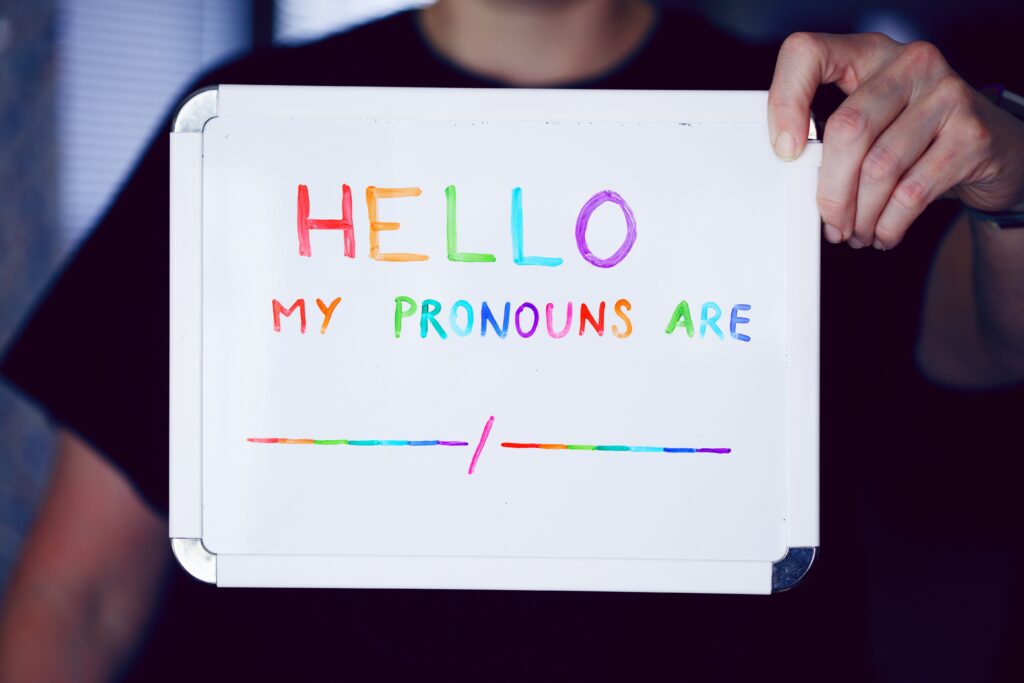 Support for your gender non-conforming child, a whiteboard with the words Hello my pronouns are written in rainbow colours